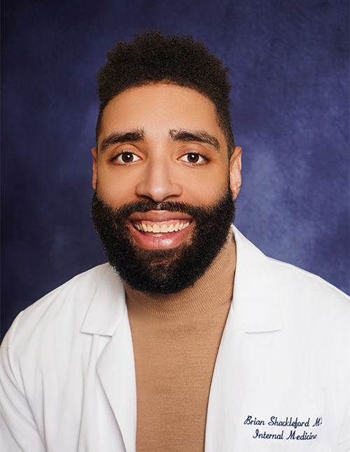 Dr. Brian Shackleford in a professional photo in a lab coat