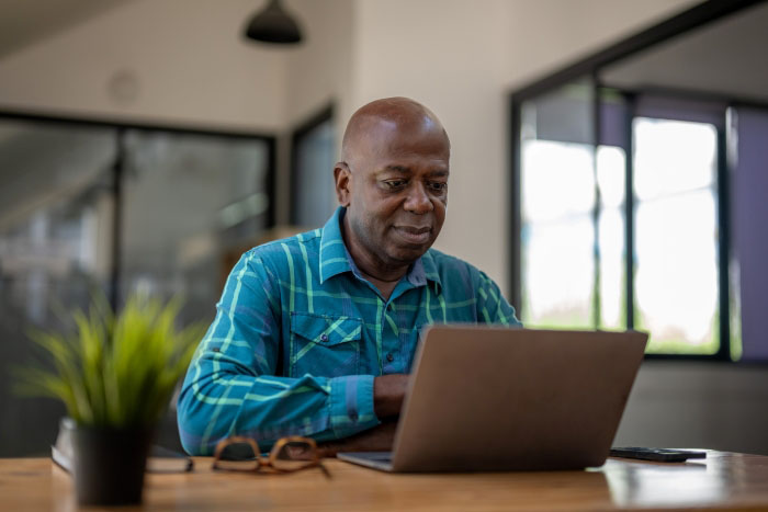 A man using his laptop at home