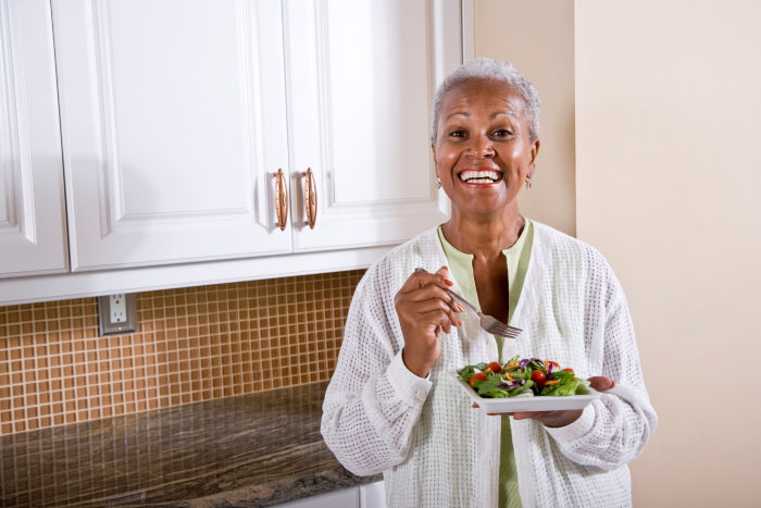 A woman eating a salad